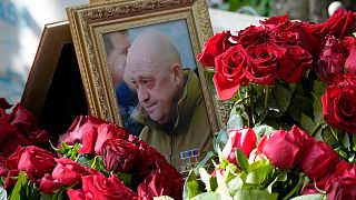 A portrait of Wagner Group's chief Yevgeny Prigozhin, who died last week in a plane crash two months after launching his brief rebellion, lies on flowers on the grave at the P