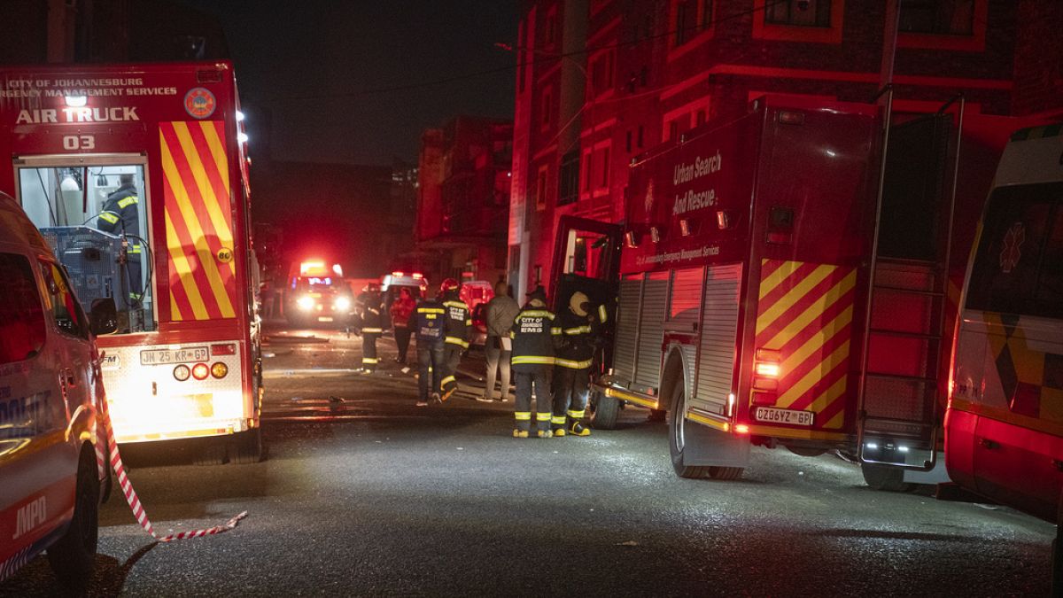 Fire fighters work on the scene of a deadly blaze that claimed the lives of dozens of people in downtown Johannesburg Thursday, Aug. 31, 2023.