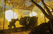 FILE - A Ukrainian serviceman of the 10th Assault Brigade Edelweiss fires a D-30 cannon towards Russian positions at the front line, near Bakhmut, Donetsk region, Ukraine.