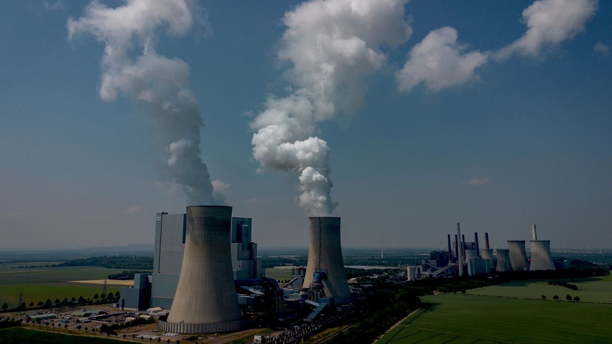 Steam rises from the coal-fired power plant in Neurath, Germany, Thursday, June 8, 2023.