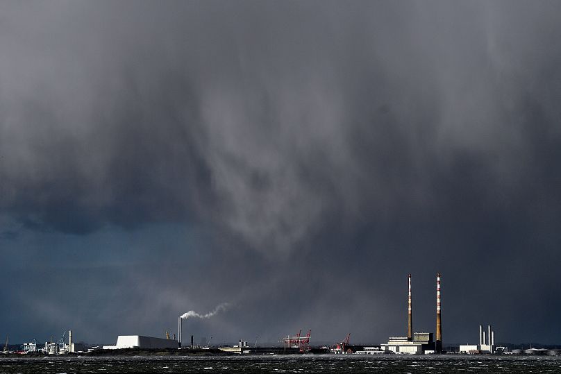 Rain clouds are seen over Poolbeg chimney stacks during Storm Eunice, in Dublin, Ireland, February 18, 2022.
