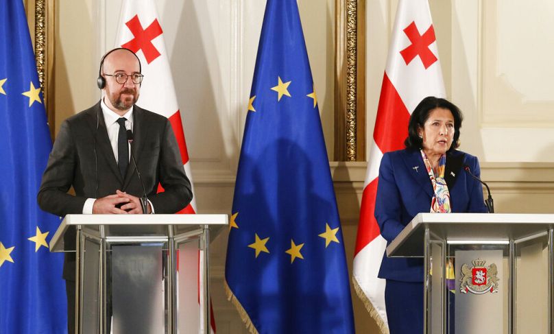 In this photo provided by the Georgian Presidential Press Office, Georgia's President Salome Zurabishvili, right, speaks during a joint news briefing with European Council Pre