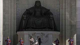 Mongolian President Ukhnaagin Khurelsukh, left, and Pope Francis meet, Saturday, Sept. 2, 2023, in front of a gigantic statue of Genghis Khan