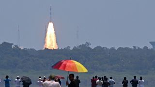 People watch as the PSLV XL rocket carrying the Aditya-L1 spacecraft is launched from the Satish Dhawan Space Centre in Sriharikota