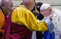 ope Francis, right, is welcomed by Choijiljav Dambajav, abbot of the Buddhists' Zuun Khuree Dashichoiling Monastery in Ulaanbaatar and Gabju Demberel Choijamts.