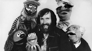 Jim Henson, creator of the Muppet Show, poses in September 1977 with some of the characters he personally operated