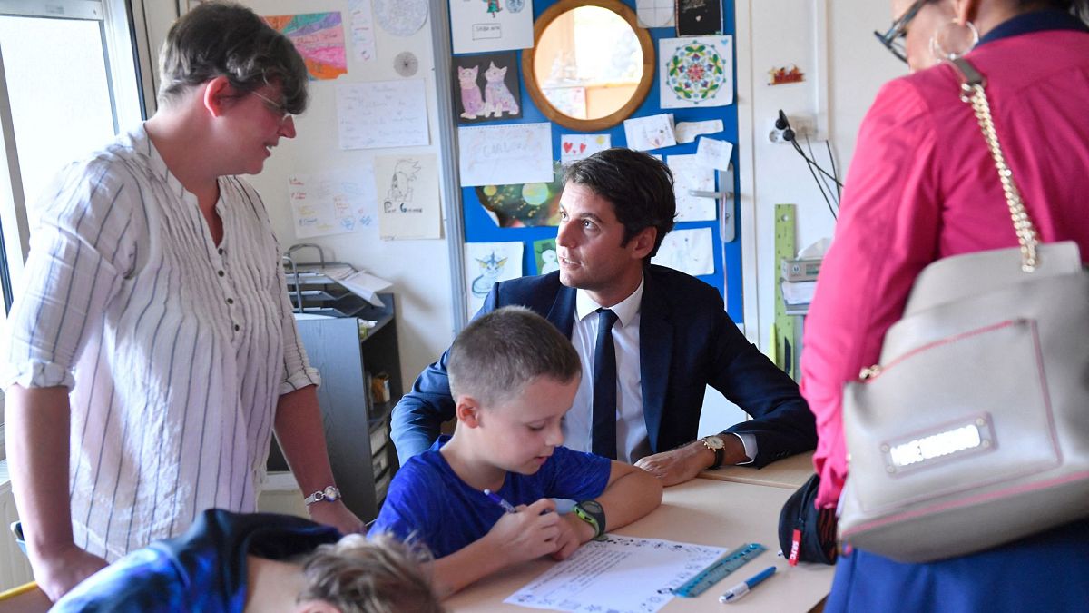 French Education Minister Gabriel Attal visits a school for the first day of the academic year in Saint-Germain-sur-Ille, in northwestern France on September 4, 2023.