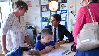 French Education Minister Gabriel Attal visits a school for the first day of the academic year in Saint-Germain-sur-Ille, in northwestern France on September 4, 2023.