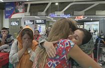 Afghan women threatened by the Taliban and exiled in neighbouring Pakistan arrive at Roissy airport in Paris.