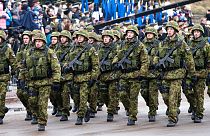 FILE Estonian troops parade in Narva, Estonia, Tuesday, Feb. 24, 2015. 