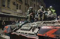 Members of the Wagner Group military company sit atop of a tank on a street in Rostov-on-Don, Russia, Saturday, June 24, 2023