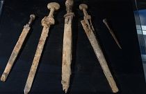 The 1,900-year-old weapons were discovered inside a cave overlooking the body of water.