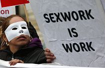 A French sex worker demonstrates outside the National Assembly in Paris, Friday, Nov. 29, 2013.
