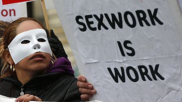 A French sex worker demonstrates outside the National Assembly in Paris, Friday, Nov. 29, 2013. 