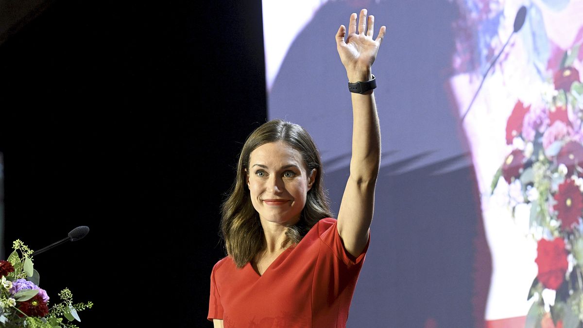  former Prime Minister of Finland Sanna Marin waves from the stage before her resignation speech on 1 September