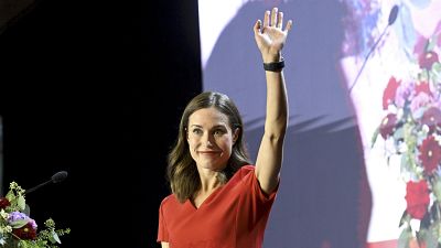  former Prime Minister of Finland Sanna Marin waves from the stage before her resignation speech on 1 September