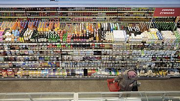 A woman shops at a supermarket in Warsaw, Poland, on Dec. 9, 2022.