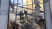 In this photo provided by the Ukrainian Emergency Service, emergency services personnel extinguish a fire following a Russian attack in Kryvyi Rih, Ukraine, Sept 8 2023
