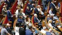 FILE - Ukraine's lawmakers react during a parliament session in Kiev, Ukraine, Wednesday, May 22, 2019.