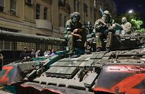 Members of the Wagner Group military company sit atop of a tank on a street in Rostov-on-Don, Russia, Saturday, June 24, 2023.