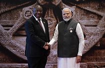 Indian Prime Minister Narendra Modi welcomes South Africa President Cyril Ramaphosa upon his arrival at Bharat Mandapam convention center for the G20 Summit, in New Delhi.