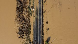 This aeriel view, taken on Friday, shows a partially destroyed road in a flooded area near the village of Itea, central Greece