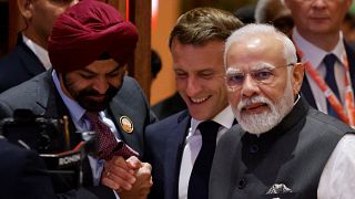 Emmanuel Macron joins Narendra Modi and World Bank President Ajay Banga at the second session of the G20 Leaders' Summit in New Delhi on September 9
