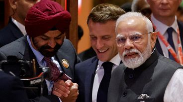 Emmanuel Macron joins Narendra Modi and World Bank President Ajay Banga at the second session of the G20 Leaders' Summit in New Delhi on September 9