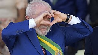 Brazilian President Luiz Inacio Lula da Silva makes a heart sign during a military parade on Independence Day in Brasilia, Brazil, Thursday, Sept. 7, 2023. 