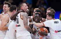 Germany celebrates after winning the championship game of the Basketball World Cup against Serbia in Manila, Philippines, Sunday, Sept. 10, 2023. (AP Photo/Michael Conroy)