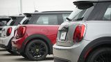 Unsold 2024 Cooper SE electric hardtops sit Friday, April 14, 2023, at a Mini dealership in Highlands Ranch, Colo.