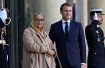 Prime Minister of Bangladesh Sheikh Hasina Wazed, left, is welcomed by French President Emmanuel Macron at the Elysee Palace in Paris, Tuesday, Nov. 9, 2021.