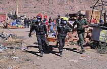 A victim is carried away by rescue workers in Talat N'yakoub, Morocco, Monday Sept. 11, 2023.
