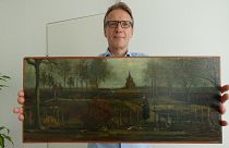 Arthur Brand with "Parsonage Garden at Nuenen in Spring" painting.