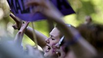 Demonstrators hold placards and shout slogans during a protest in Madrid AGAINST "La Manada"