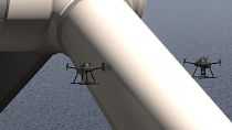 A SpectX autonomous drone inspects a wind park.