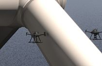 A SpectX autonomous drone inspects a wind park.
