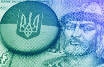 One Ukrainian hryvnia bill with a Ukraine crest pin, illustration