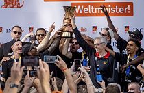 The German basketball team celebrates with fans after their arrival in Frankfurt, Germany, Tuesday, Sept. 12, 2023. 