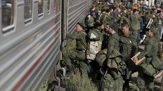 Russian recruits take a train at a railway station in Prudboi, in Russia’s Volgograd region, Thursday, Sept. 29, 2022.