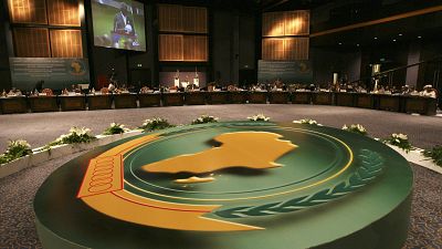 Ghana's president John Agyekum Kufour is seen on TV screens during the closing session of the African Union summit in Sharm el-Sheikh, Egypt, Tuesday, July 1, 2008.