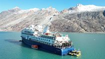 View of the Ocean Explorer, a luxury cruise ship carrying 206 people that ran aground, in Alpefjord, Greenland, 13 September 2023.