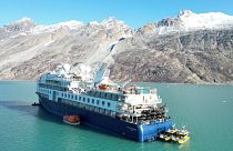 View of the Ocean Explorer, a luxury cruise ship carrying 206 people that ran aground, in Alpefjord, Greenland, 13 September 2023.