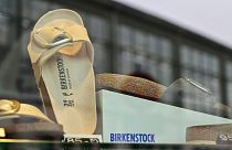 Sandals of the German sandals and shoes maker Birkenstock are pictured in a store window at the company's store in Berlin on February 26, 2021.