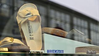 Sandals of the German sandals and shoes maker Birkenstock are pictured in a store window at the company's store in Berlin on February 26, 2021.