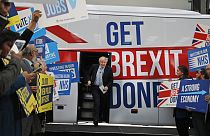 Then-Prime Minister Boris Johnson addresses his supporters prior to boarding his General Election campaign trail bus in Manchester, England in 2019