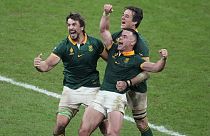 South Africa players celebrate at the end of the Rugby World Cup final match between New Zealand and South Africa at the Stade de France in Saint-Denis, near Paris Saturday, O