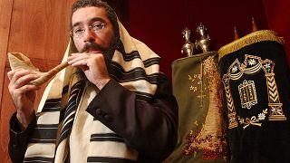 Rabbi Eliyahu Schusterman of Atlanta's Chabad Intown, blows a shofar at the congregation's small Jewish temple in Atlanta Wednesday, Sept. 28, 2005.
