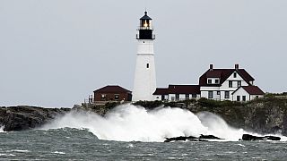 Waves crash against the rocks at Portland Head Light, Saturday, Sept. 15, 2023, in South Portland, Maine. 