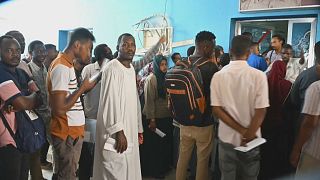 Desperate Sudanese face endless wait for passports to flee war